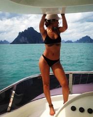 http://54d0346027abc14ae3e7-b90b9cc78379186d39ad1faad6456619.r17.cf3.rackcdn.com/3188-Rihanna-reveals-killer-bikini-body-posts-snaps-from.jpg